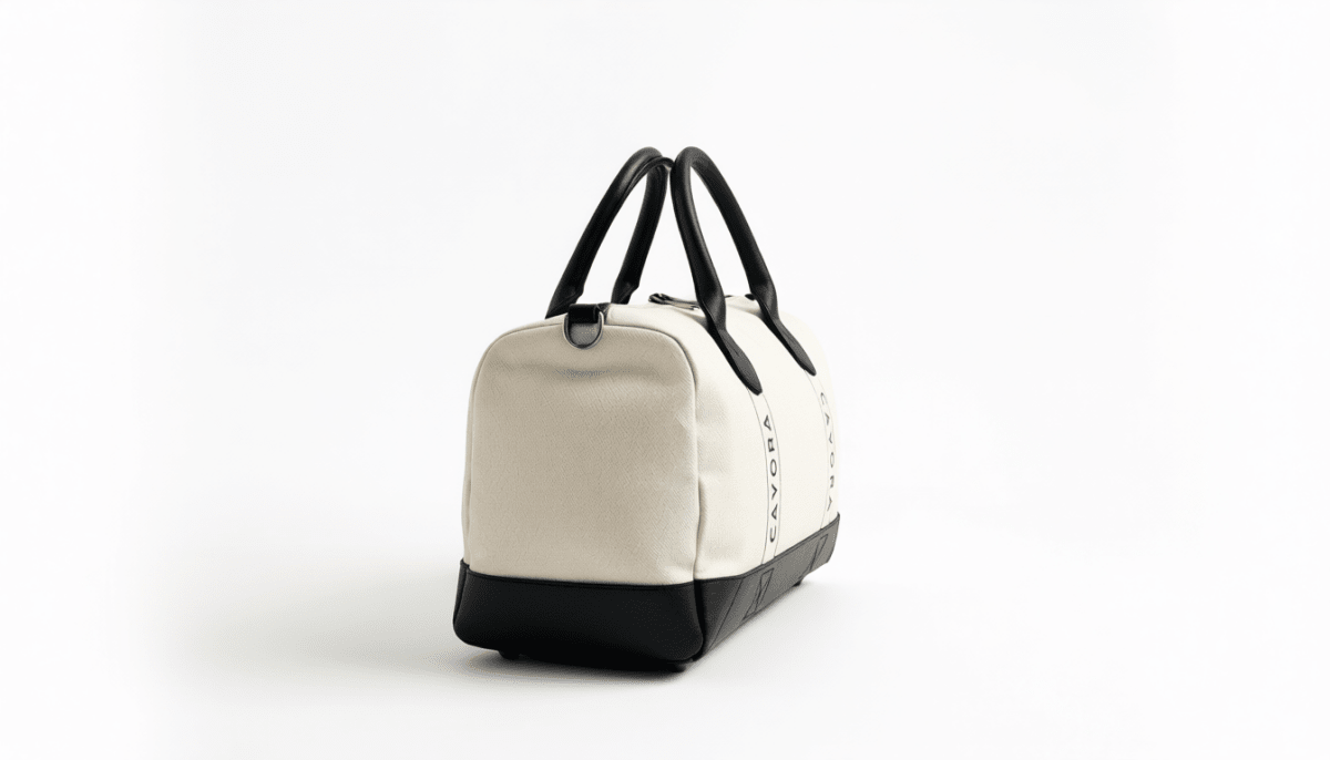 White handbag with black accents on a white background
